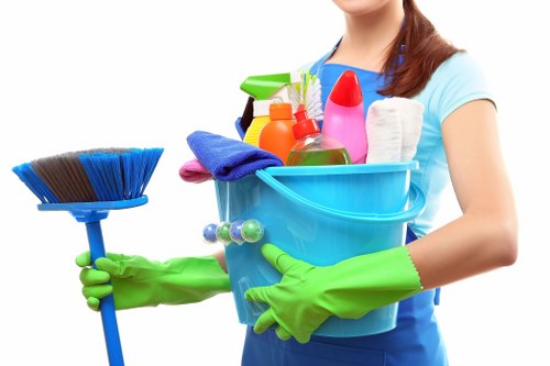 Commercial cleaner preparing a tidy and hygienic workspace in NW10