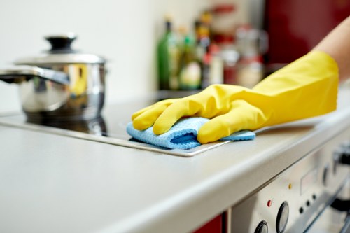 Technician assessing a stain on fabric or carpet during a NW10 visit
